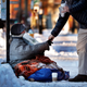 Illustration for article titled This Viral Photo of a Homeless Person Freezing on the Street Is Actually From 2013... in Canada